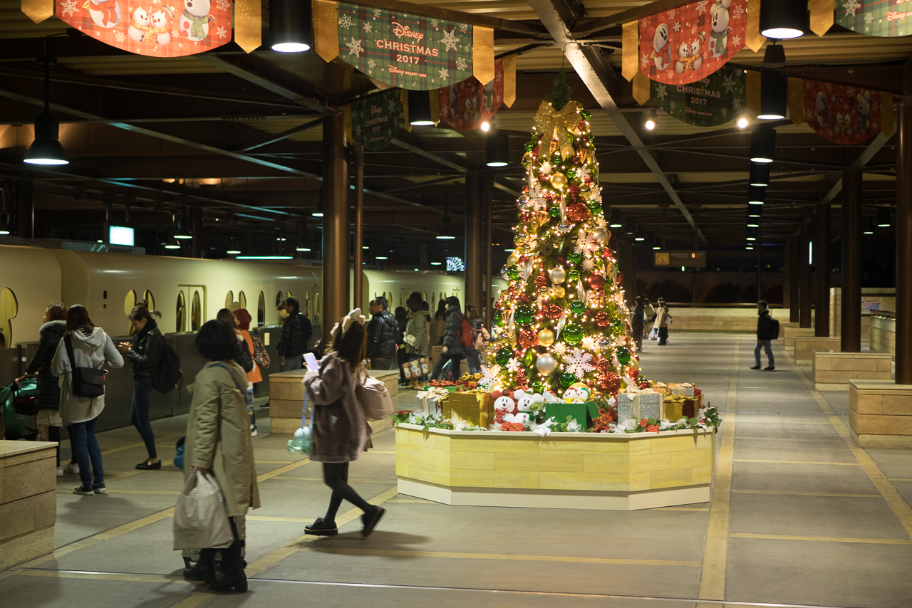 The monorail station platform at DisneySea, with a large christmas tree on the platform